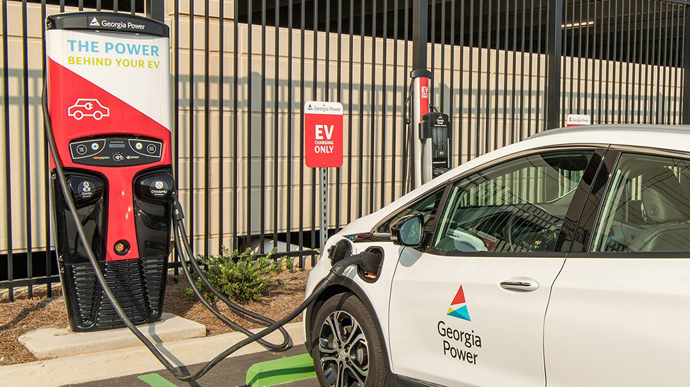 Car at electric charging station