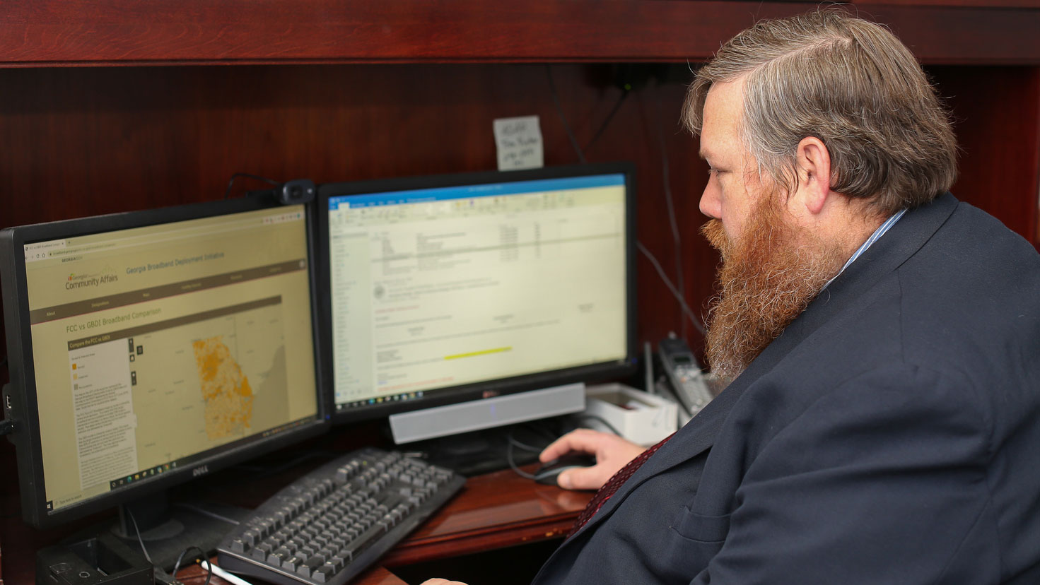 picture of Eric McRae looking at his computer screen