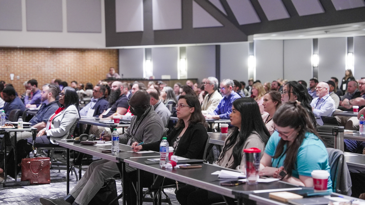 people sitting at a conference.