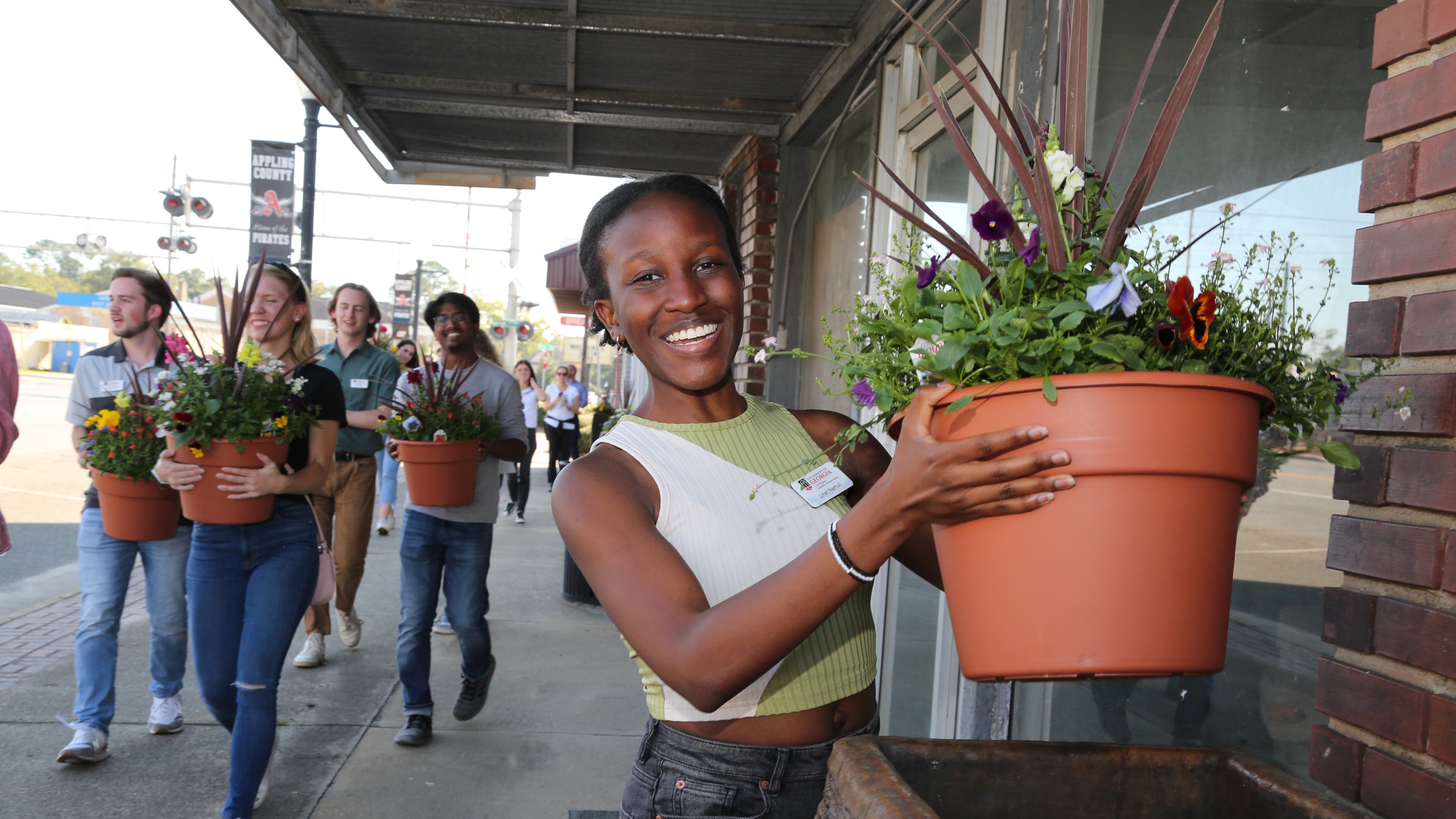 Photo of PROPEL Rural Scholars students holding flower pots