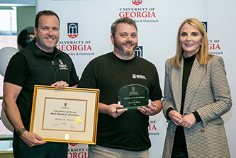 Rob Gordon, Carl Vinson Institute of Government Director (L) and Jennifer Frum, Vice President for Public Service and Outreach (R) present the 2023 Staff Award to James Byars. (Photo: Shannah Montgomery/PSO) 