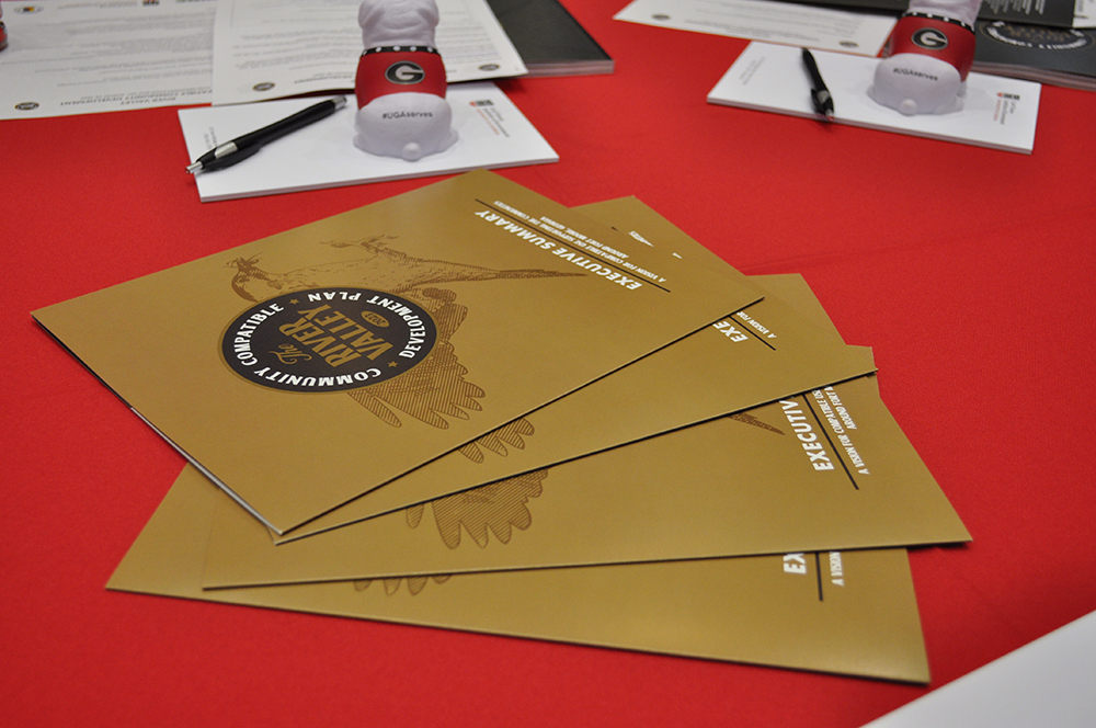 Executive Summaries were placed on tables throughout the Aug. 18 meeting. (Photo by Sara Ingram)