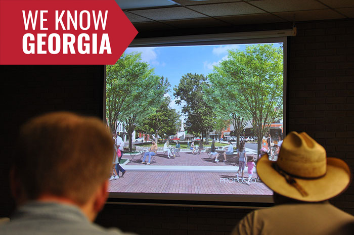 Members of the Elberton community view a presentation of designs by Sam Nash Riggs, a graduate student in the UGA College of Environment and Design, who worked with the city for 12 weeks on ideas and visual concepts to spur community development and growth. 