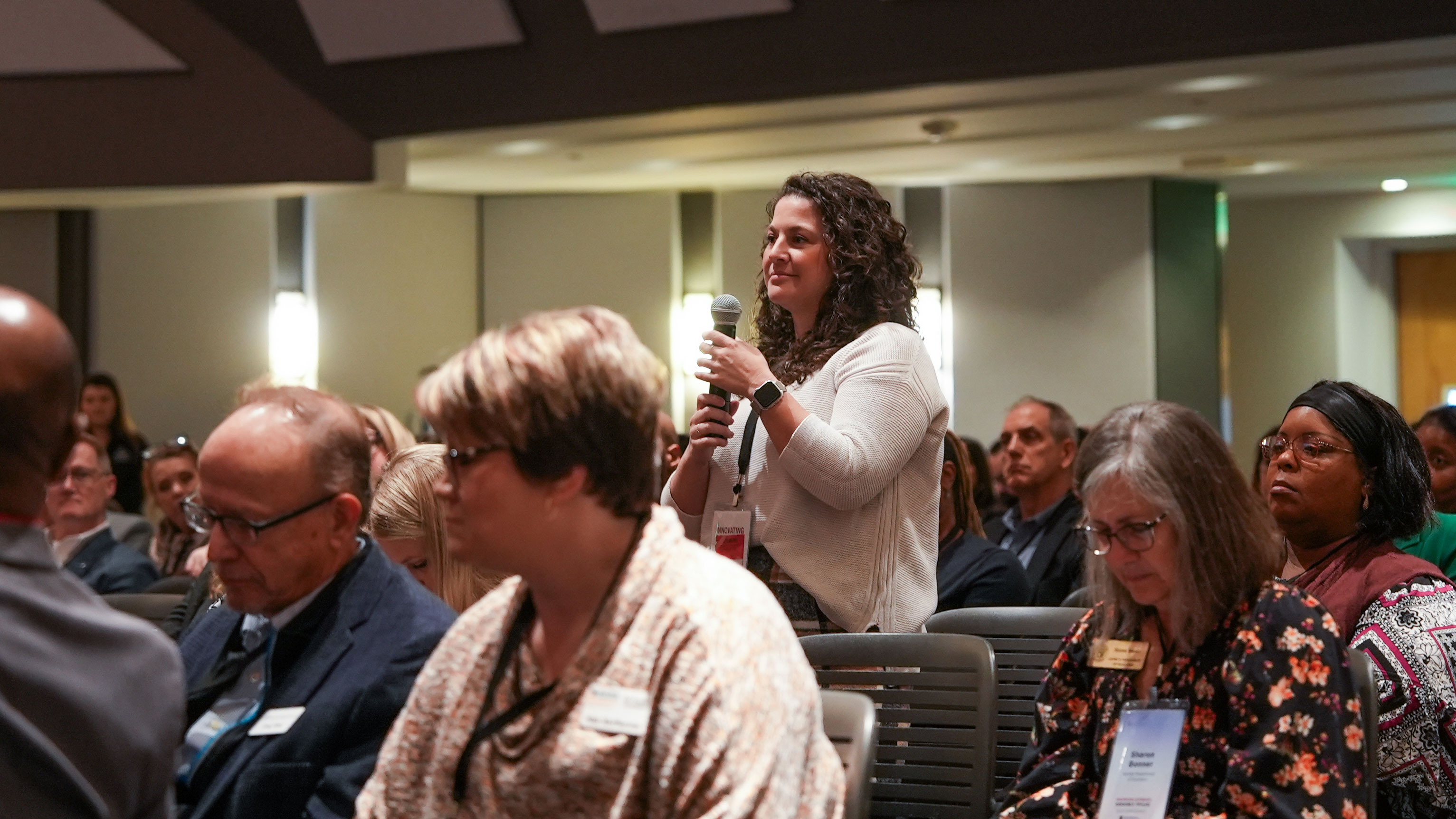 An attendee asks a question during a plenary session at the Innovating Georgia's Workforce Pipeline Conference.