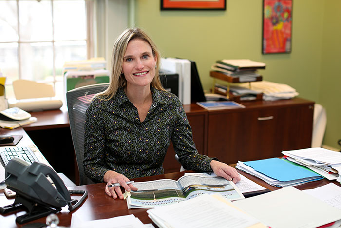 picture of Associate Director Shana Jones at her desk.