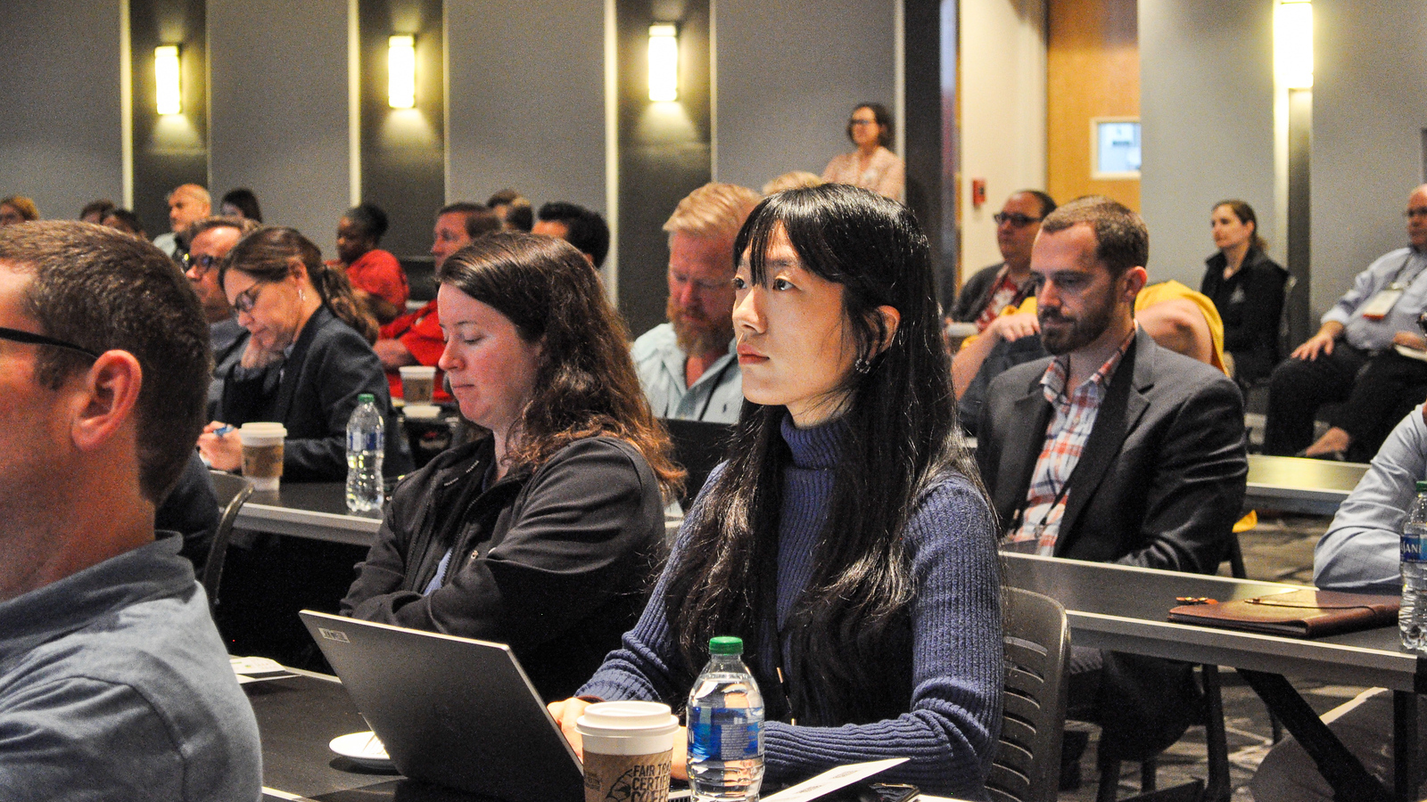 People listen to a presentation at the 2023 Developing Data Analytics Capabilities Conference. Conference attendees have the opportunity to connect with experts in the field, identify their organizations’ data readiness, and consider next steps for increasing data analytics capabilities.