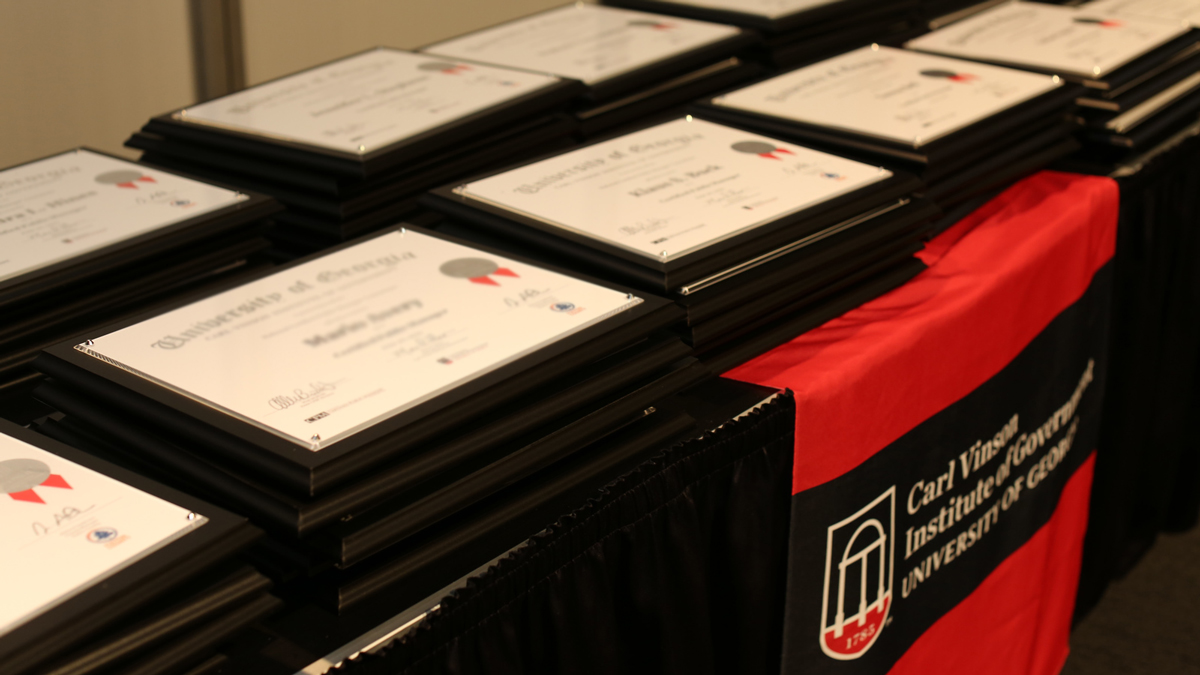 Picture of CPM certificates on a table.