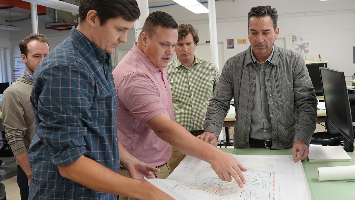 Daniel Wyatt (second from left) connects military communities with UGA resources and knowledge through the Defense Community Resilience Program, working with students and faculty on plans that make installations more resilient.