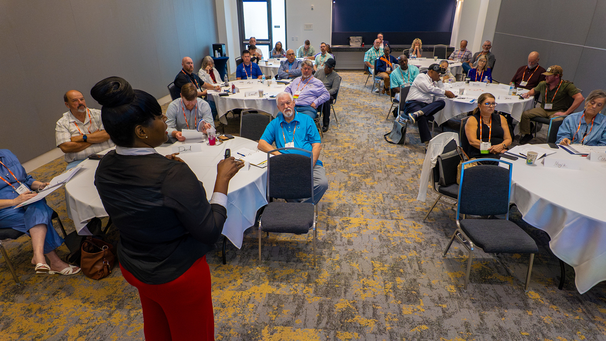 A teacher standing in front of a class at the ACCG Conference.