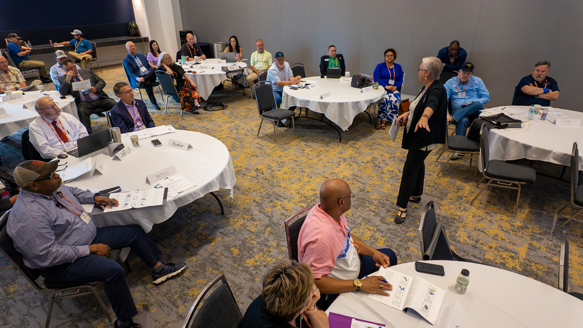 picture of person talking to a room full of people