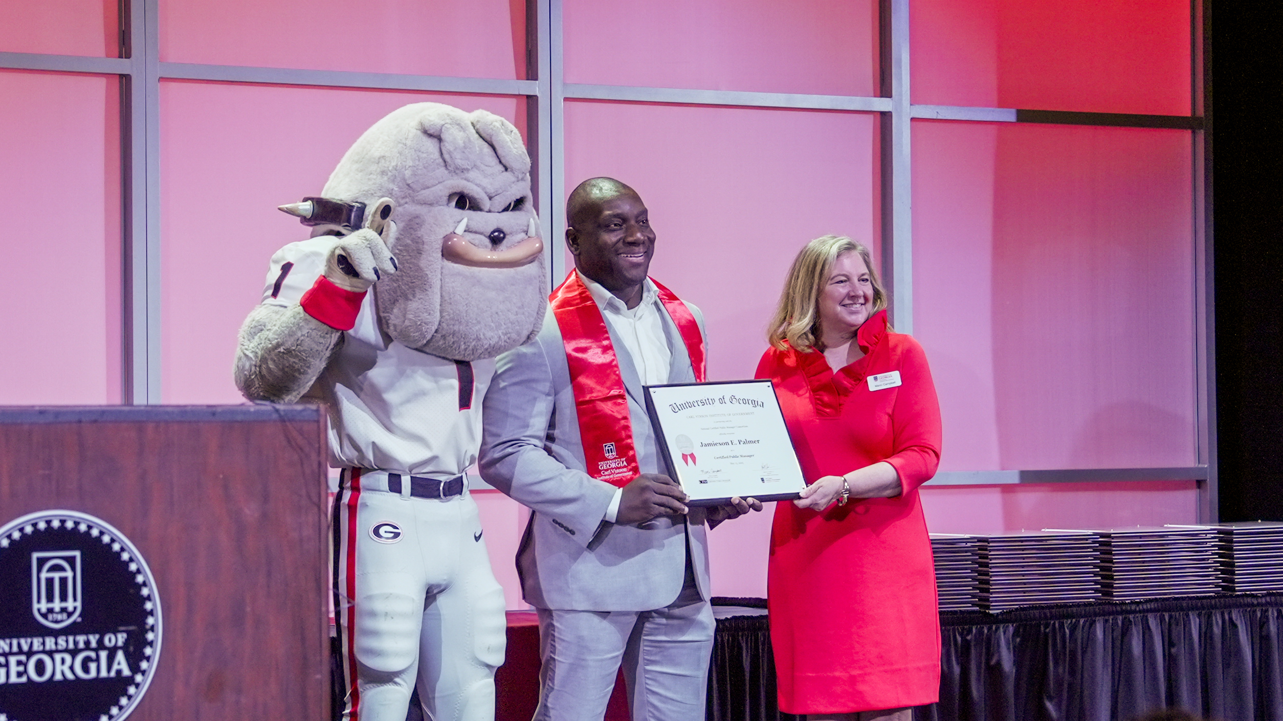 Jamie Palmer, Marci Campbell and Hairy Dawg with CPM certificate
