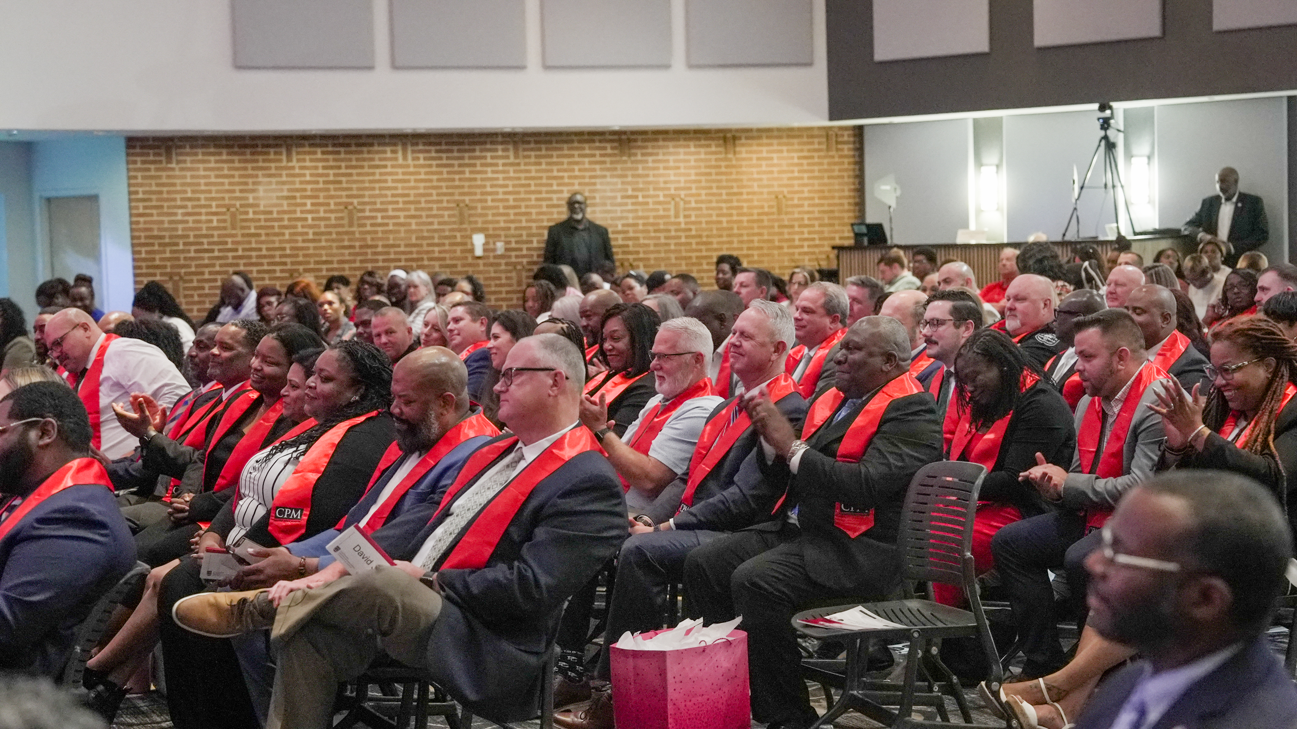 2025 CPM graduates applauding.