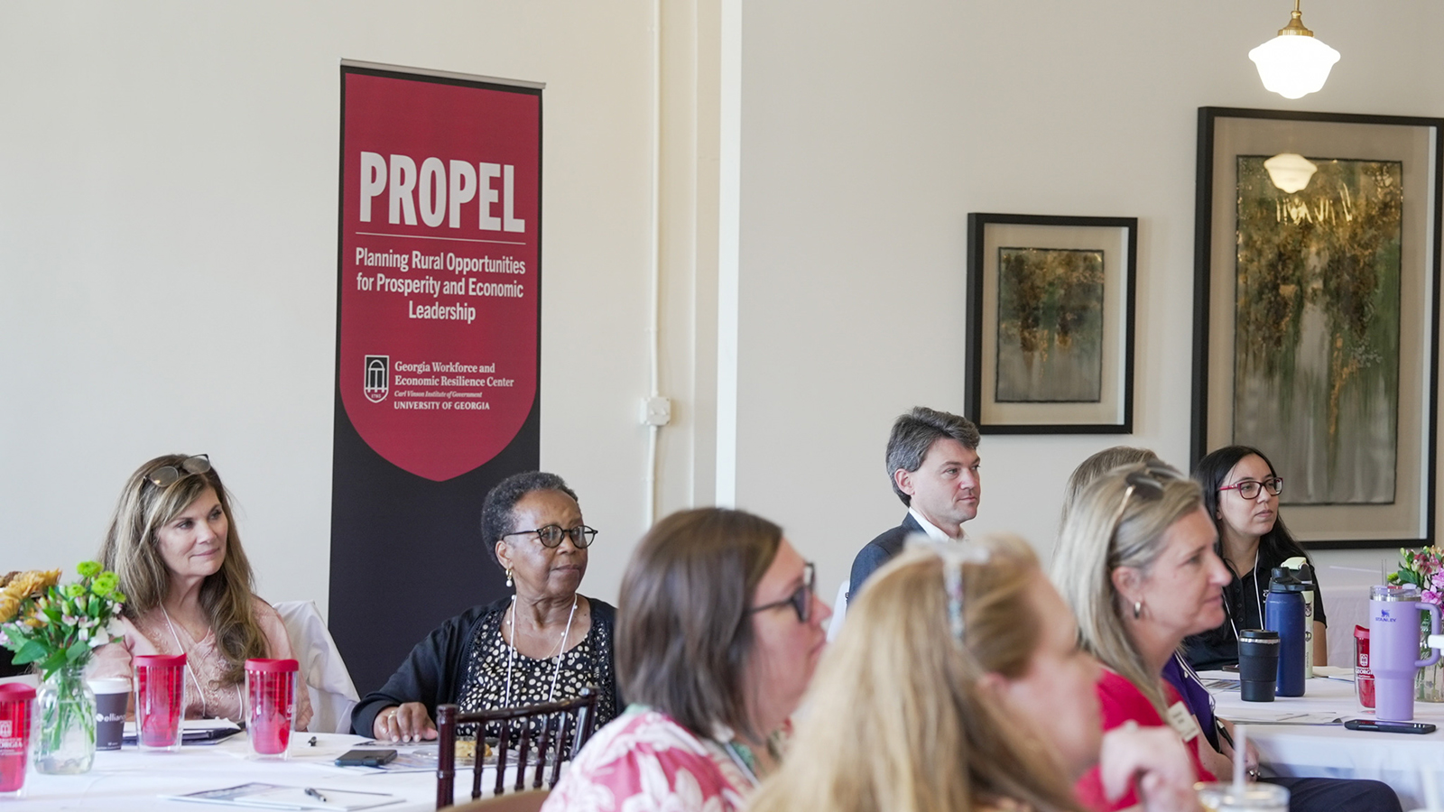 People listen to a presentation 
