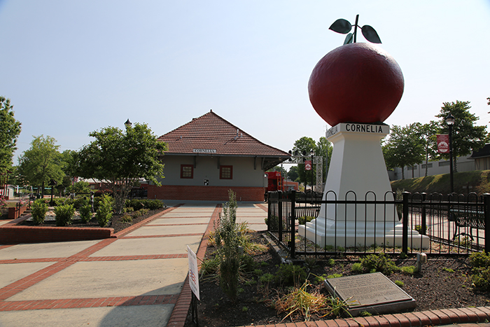 “The Home of the Big Red Apple” monument represents the area’s agricultural legacy. 