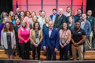 Members of the first cohort of the Data Analysis and Decision Making for Government certificate program pose with the program’s instructors. The cohort graduated at the Developing Data Analytics Capabilities Conference, March 24.